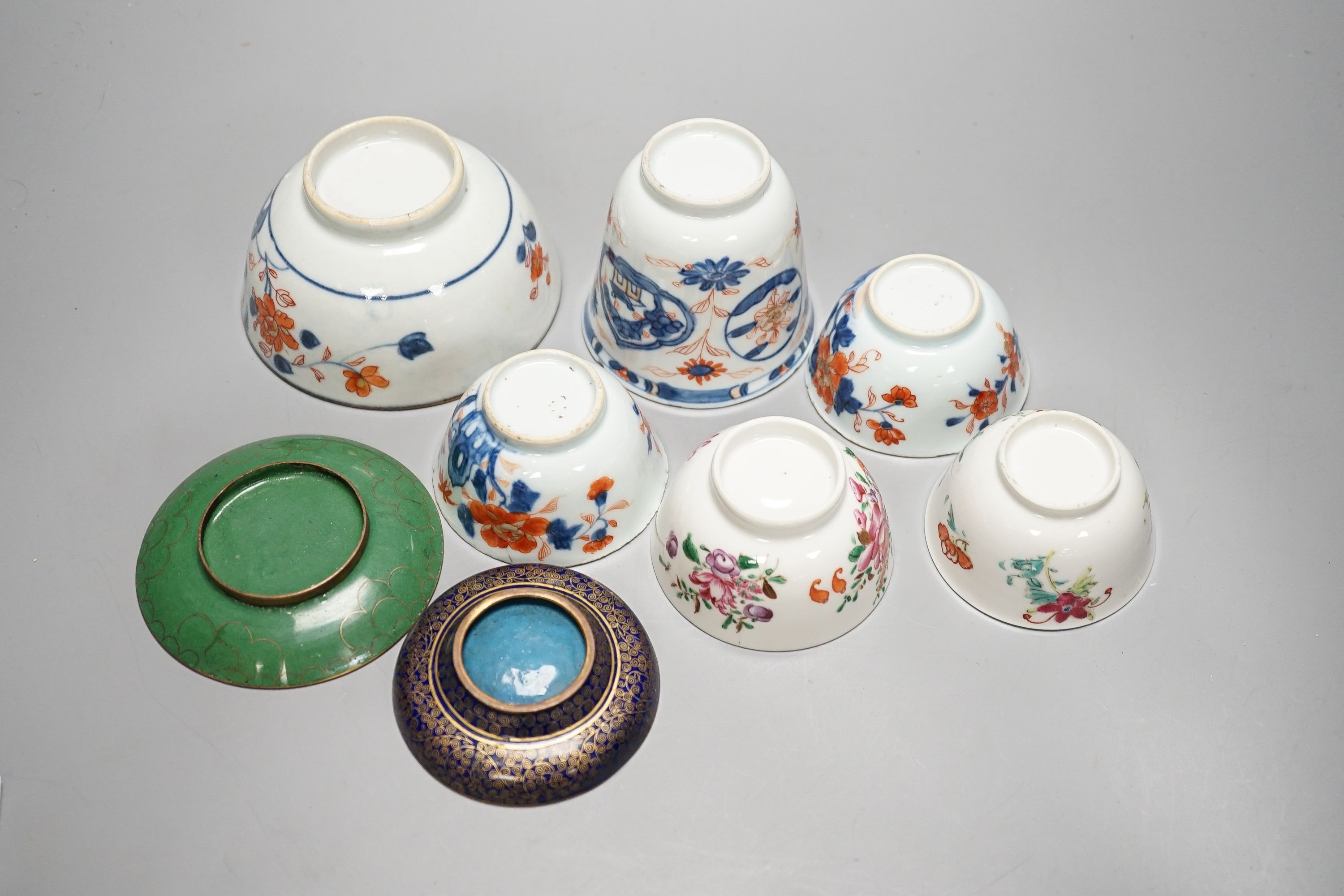 A collection of 18th century Chinese export porcelain tea bowls or cups and two cloisonné enamel dishes